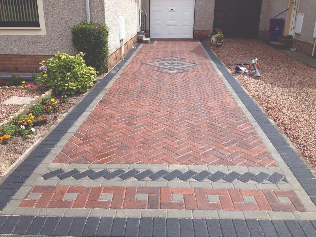 Herringbone block driveway with a geometric border
