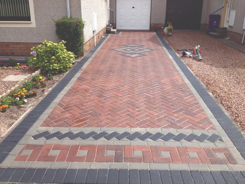 Herringbone block driveway with a geometric border